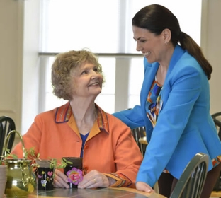 Independent living staff member talking with resident